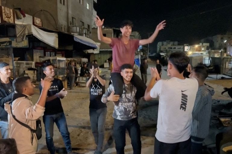 Palestinians take to street to celebrate ceasefire deal announced by Trump (video)