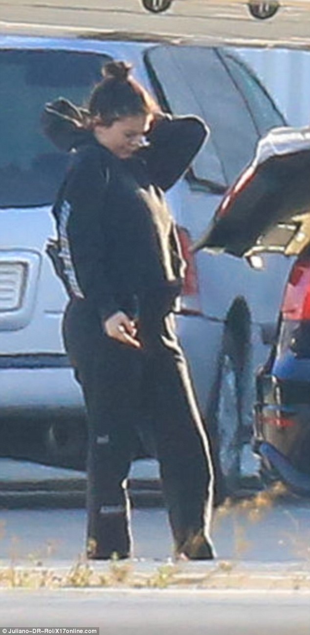 Kylie Jenner debuts her bump for the first time in baggy clothes