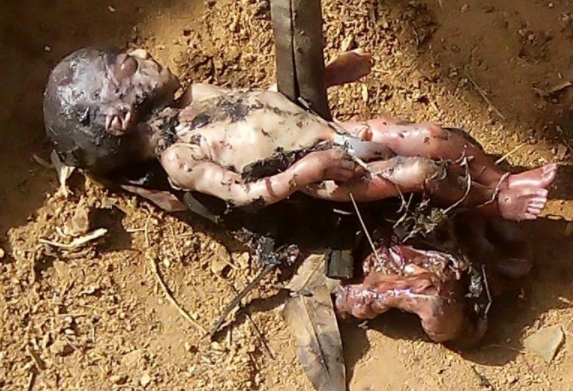 Kids found a dead baby in gutter in Kaduna and mistook it for a toy (graphic photos)