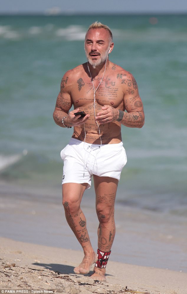 Shirtless Italian playboy Gianluca Vacchi and his eggplant pictured at the beach (Photos)