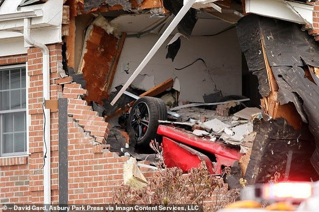 22-year-old Porsche driver and his passenger are killed after car flew off the road and crashed into the second story of a building