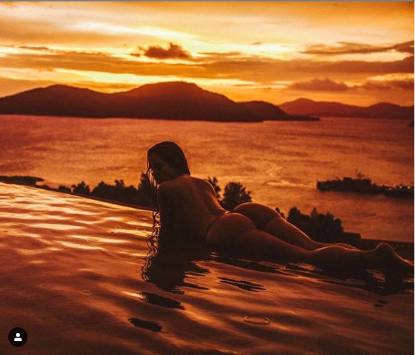 British model, Demi Rose shows off her bare backside as she poses nude in new photos