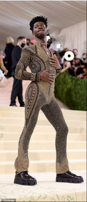 Lil Nas X debuts three outfits on the Met Gala red carpet including a gold suit of armor (photos)
