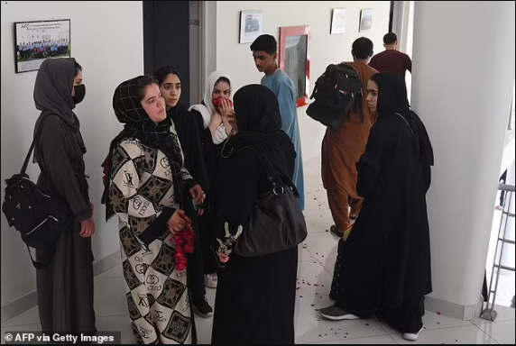 Afghanistan?s girl?s football teams flee across the border to Pakistan wearing burqas 