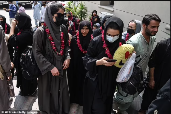 Afghanistan?s girl?s football teams flee across the border to Pakistan wearing burqas 