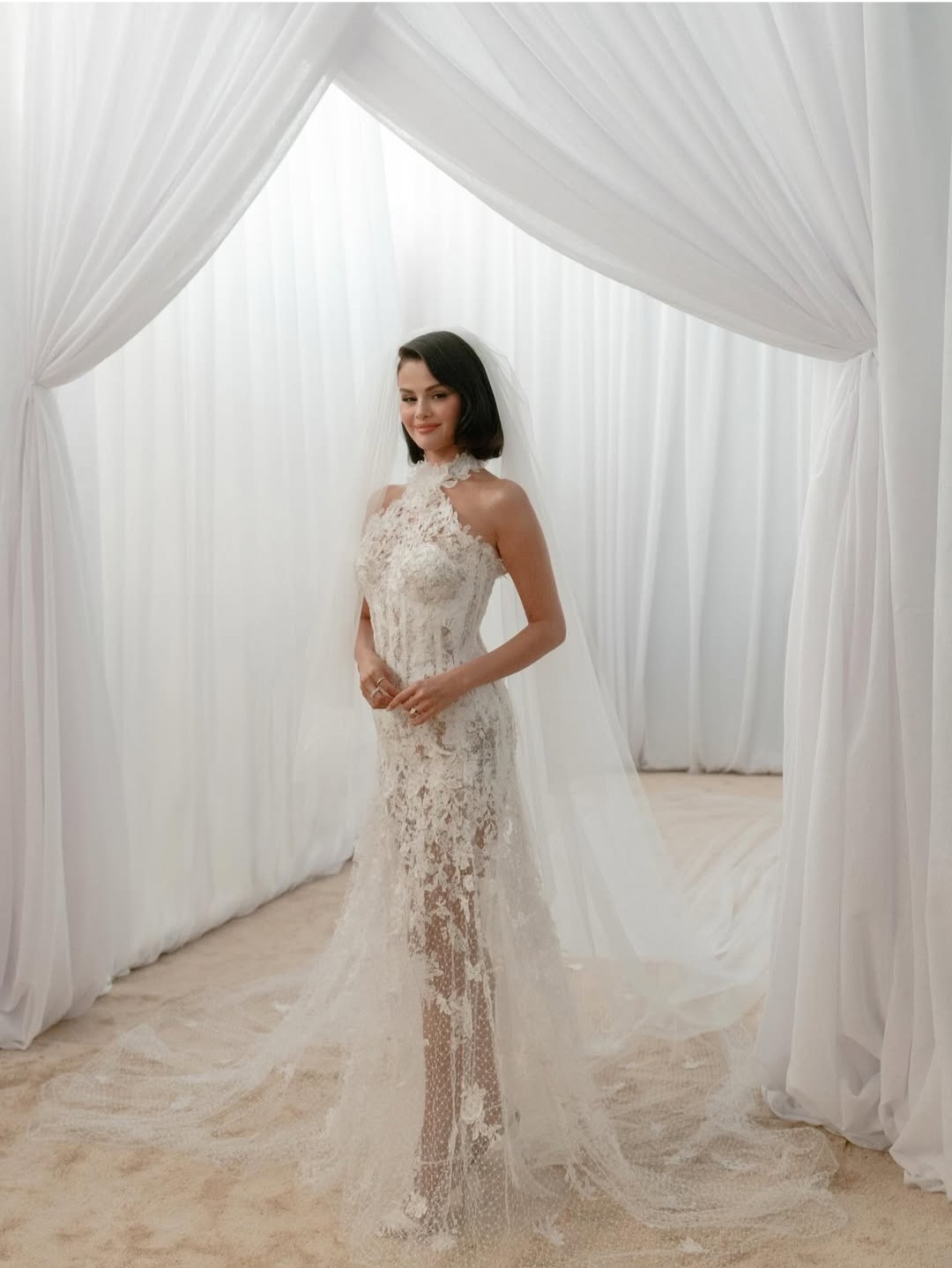 Actress, Selena Gomez shares new photos displaying the three wedding dresses she wore as she married Benny Blanco