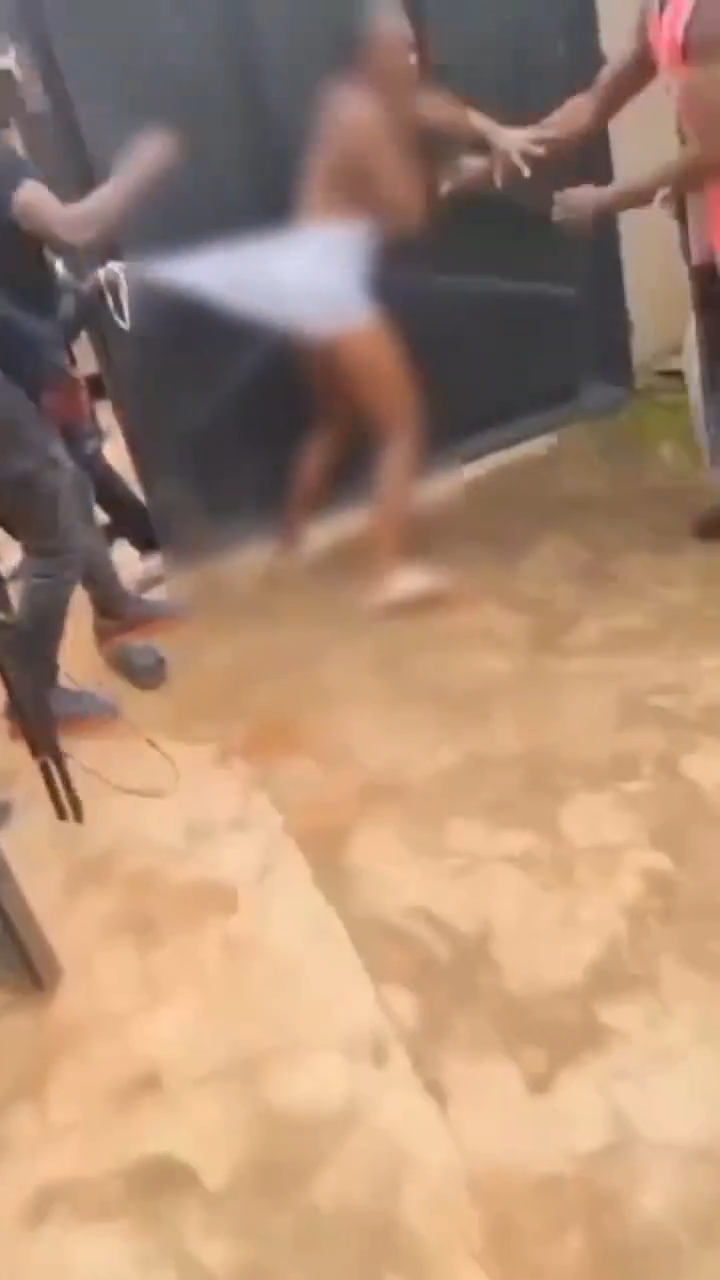 Female corps member is str!pp�d completely n@k3d and b?aten up by g^n-wielding Anambra vigilante officials in shocking video