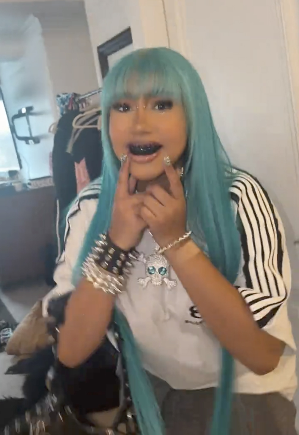 Kanye Westâs daughter North West shows off new bridge piercing, blackened teeth and diamond pendant in TikTok videos